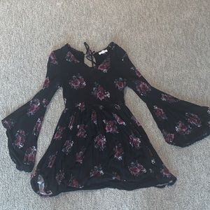 black dress with purple flower detailing